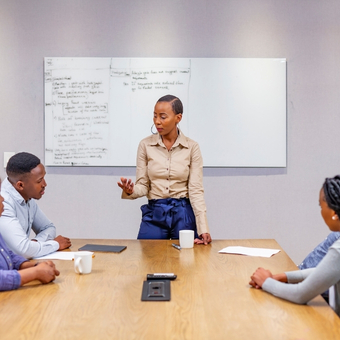 Executive presenting during a leadership communication workshop.